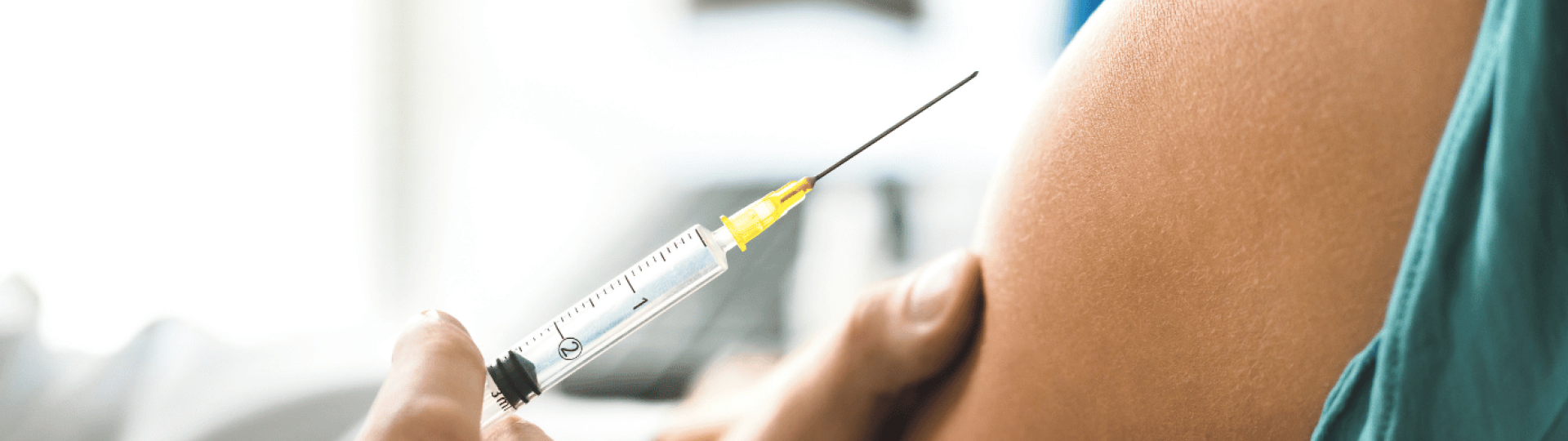 person being injected - syringe